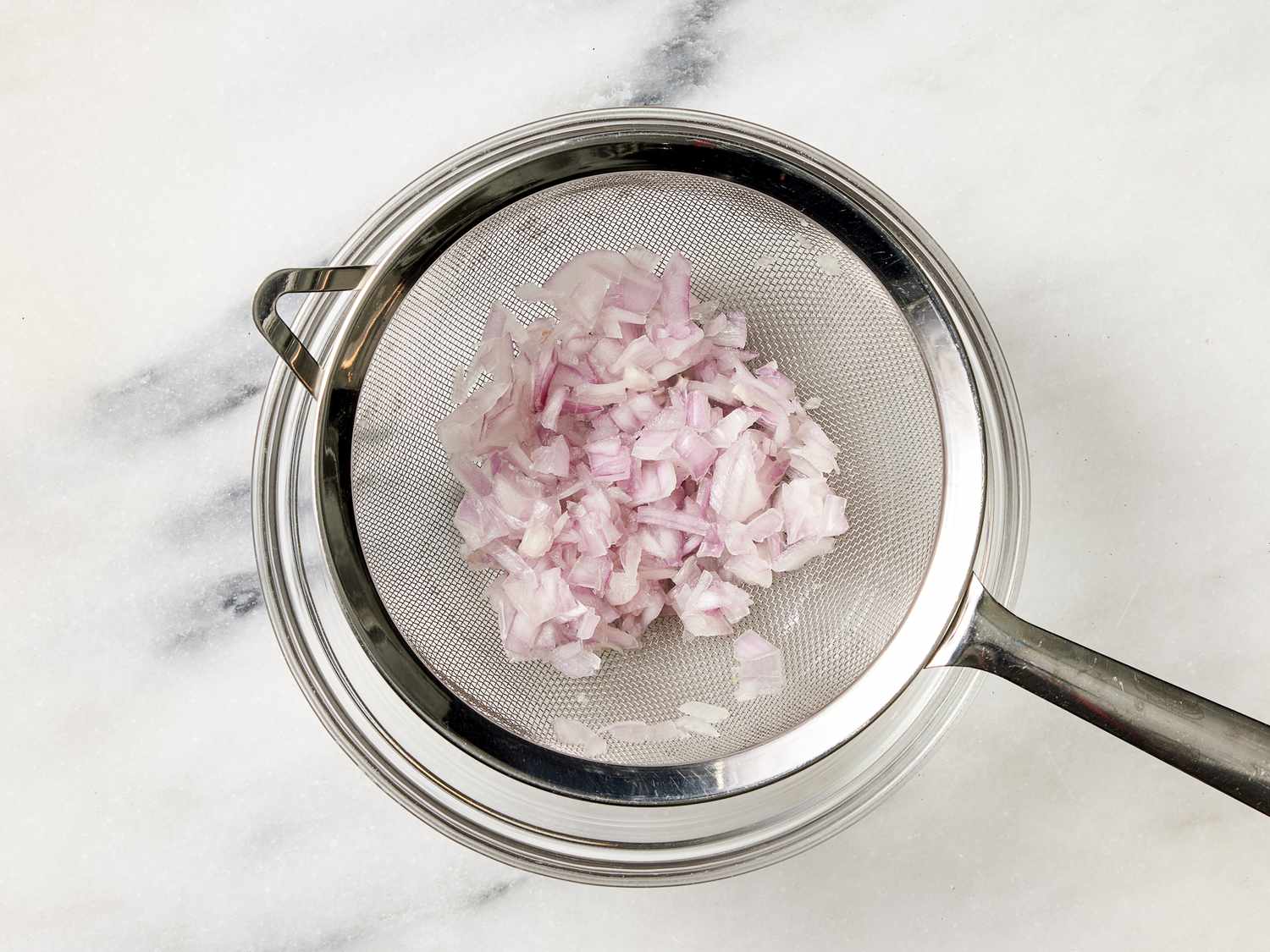 Overhead view of draining onions