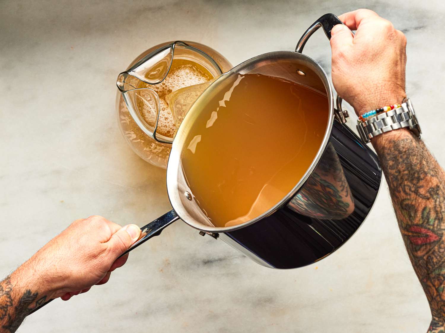 Overhead view of pouring punch into pitcher