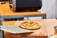 A pizza after removal from the Ooni Volt 12 Electric Pizza Oven