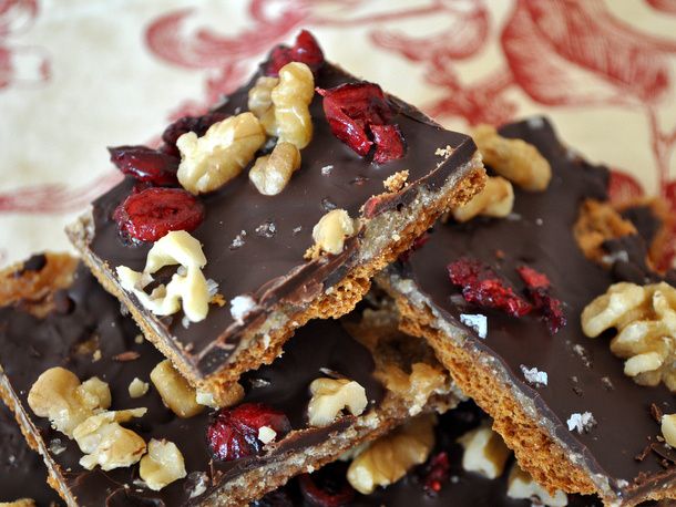 Closeup of Cranberry Chocolate Walnut Brickle, broken into square pieces.