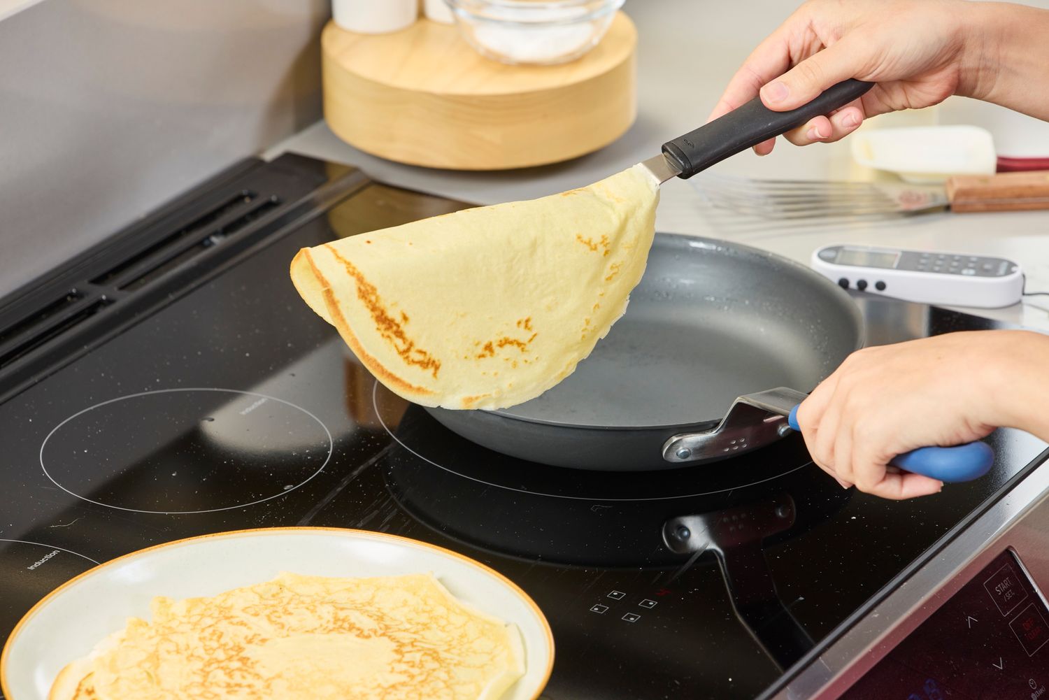 A crepe is cooked in the Misen Pre-Seasoned 10 Inch Carbon Steel Pan