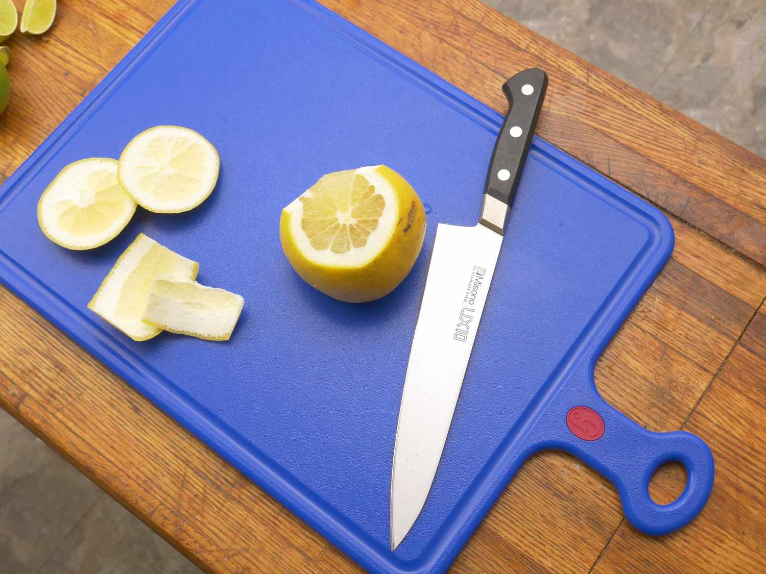 a pomelo and a knife on the great jones board