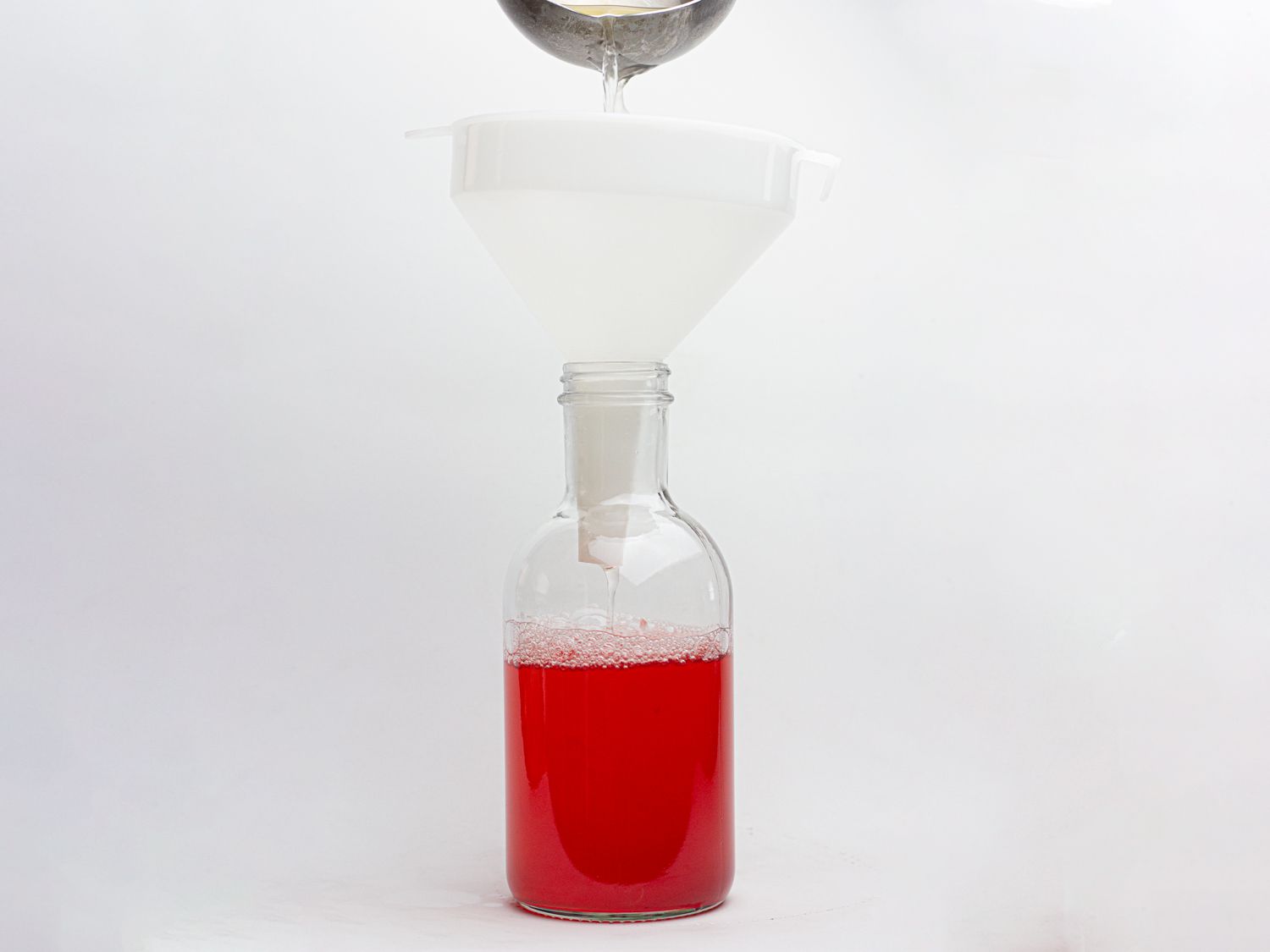 Bottling parsley strawberry kombucha