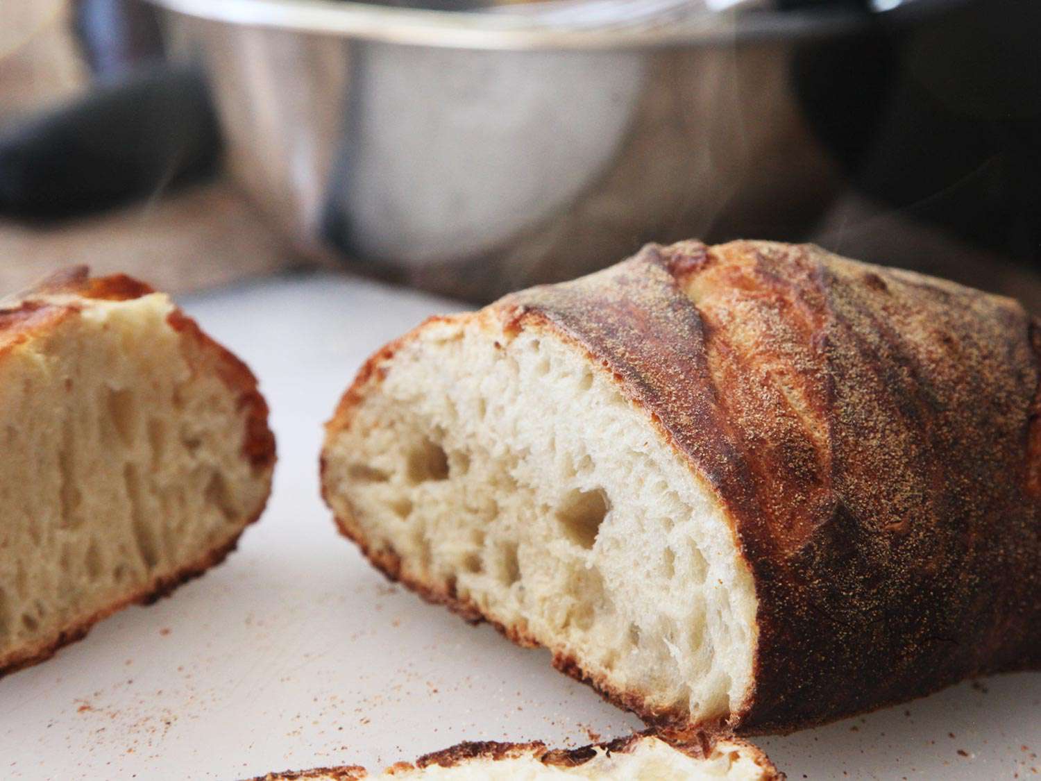 A loaf of bread baked in a Forneau bread oven cut in half. 