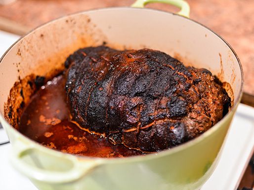 The finished smoked lamb barbacoa after braising, ready to be carved and served.