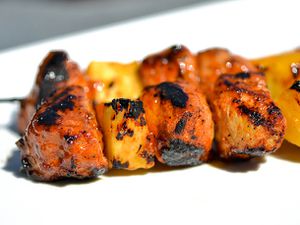 Closeup of Sweet and Spicy Apricot-Glazed Pork and Pineapple Kebabs