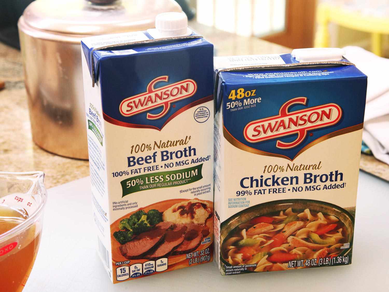 Box of beef broth next to box of chicken broth.
