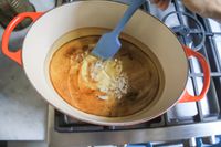 A spatula stiring FryAway Pan Fry Cooking Oil Solidifier in oil