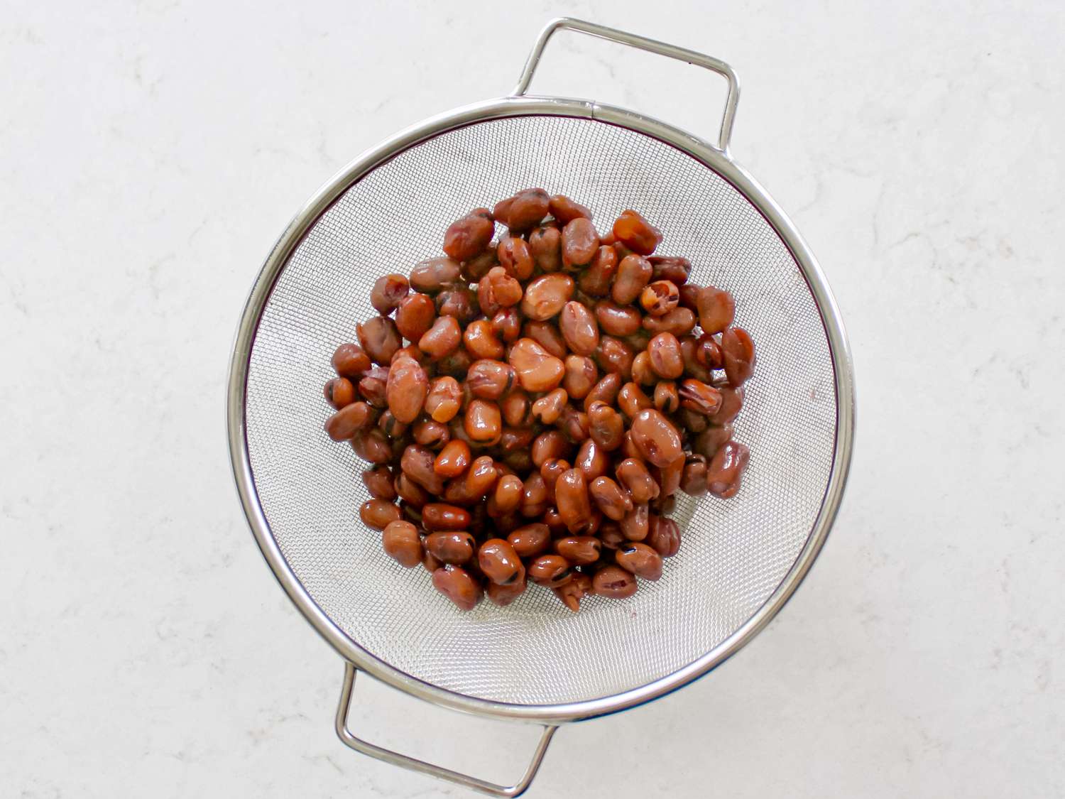 Overhead view of rinsed fava beans