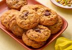 Plate of freshly baked pistachio chocolate chip cookies