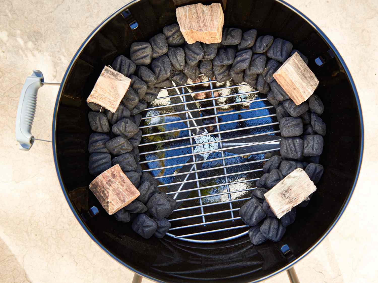 Adding wood to grill set up