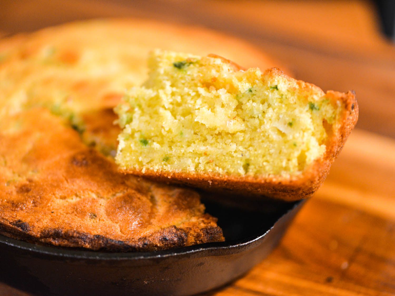Taking a slice of jalapeno jack cornbread out of the skillet. 