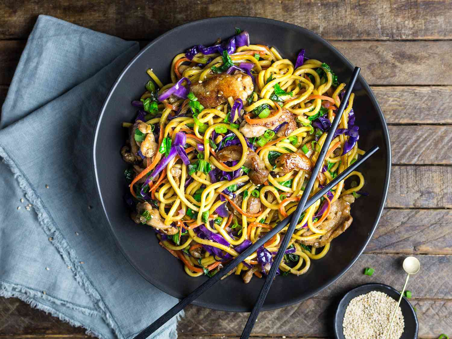An overhead shot of colorful stir-fried lo mein with red cabbage