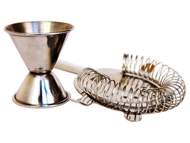 A cocktail jigger and a strainer. 