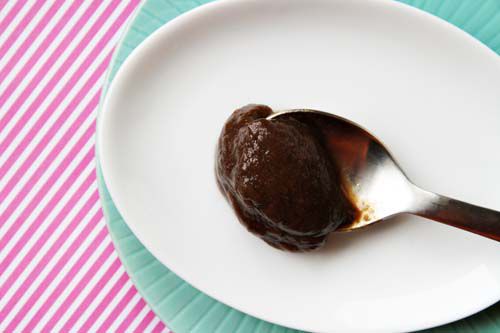 A spoonful of tamarind paste on a white plate 