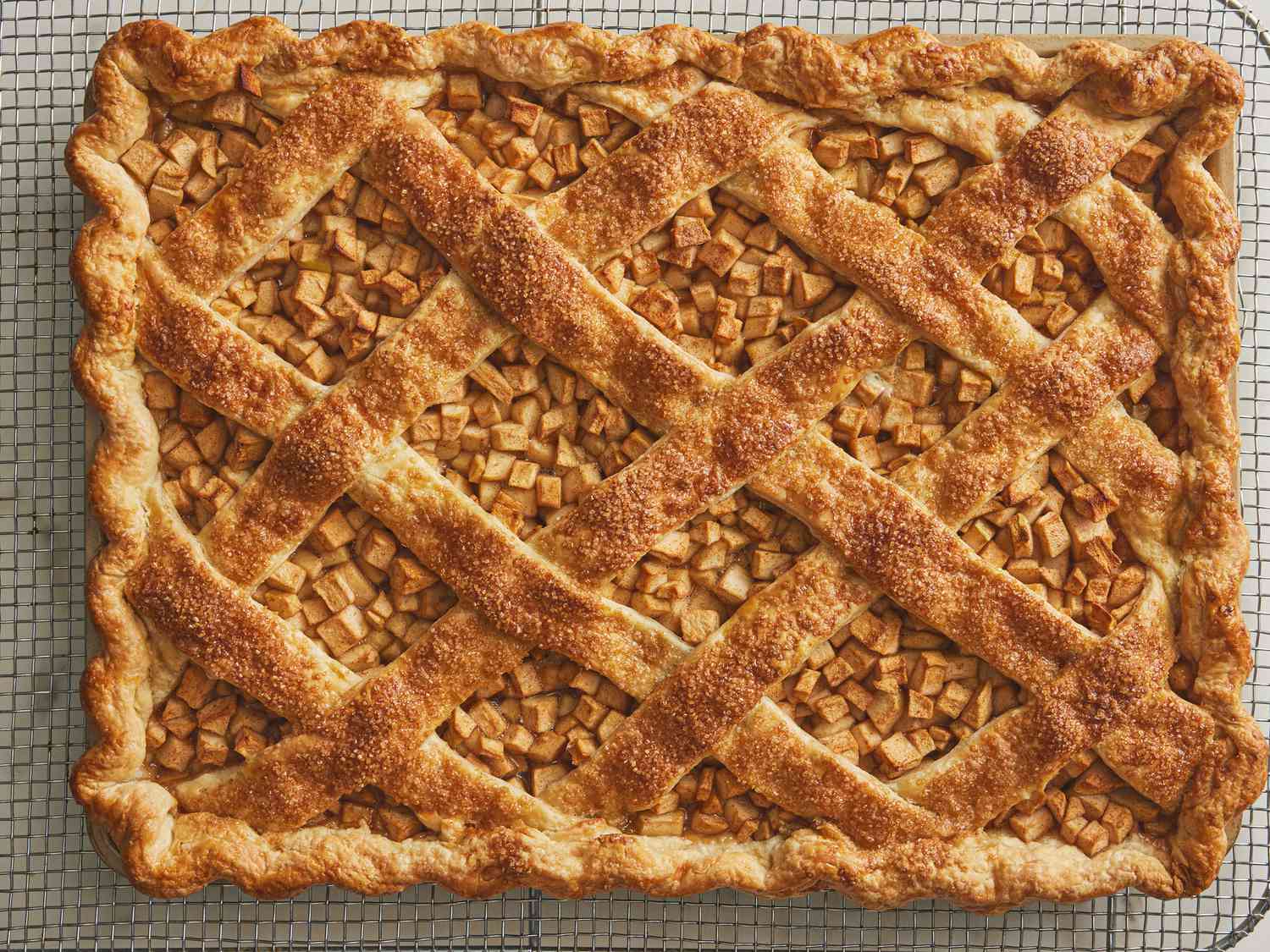 Finished baked apple slab pie on cooling rack 
