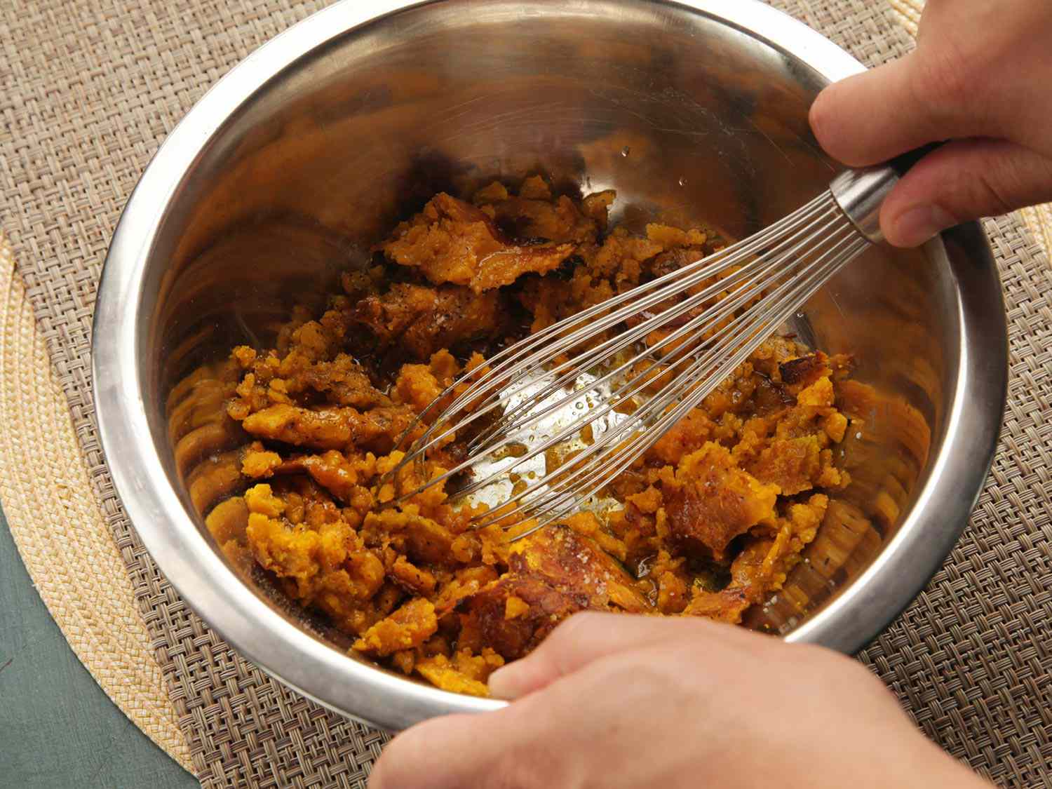 A rough mash of roasted kabocha squash about to get whisked with other ingredients.