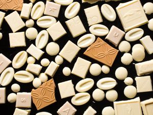 Collage of white chocolate pieces 