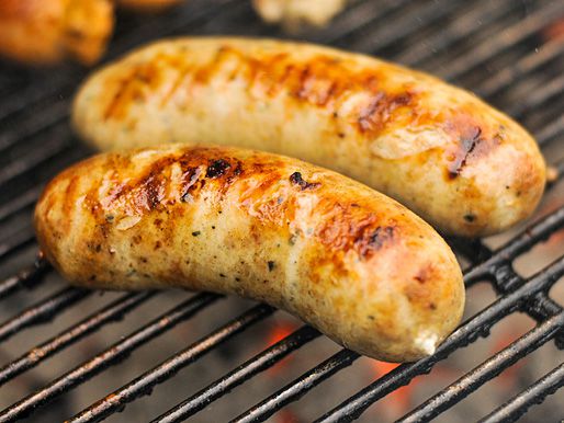 Roasted Garlic and Feta Chicken Sausages on a grill