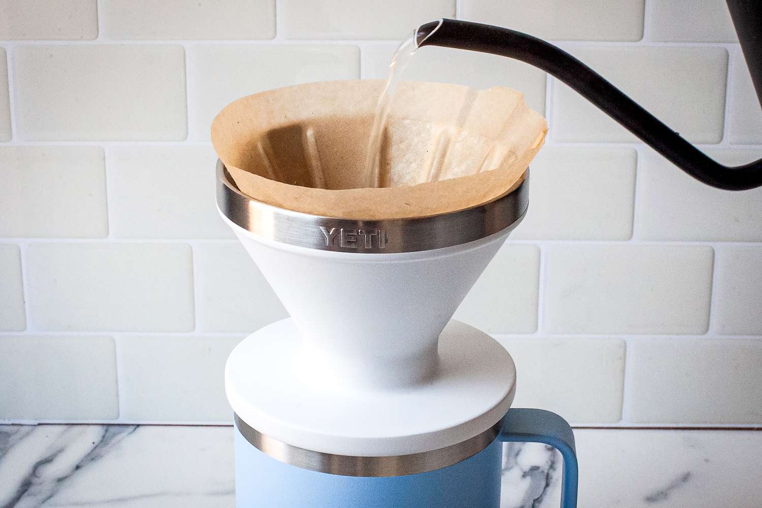 A kettle pouring water over the Yeti Rambler Pour-Over