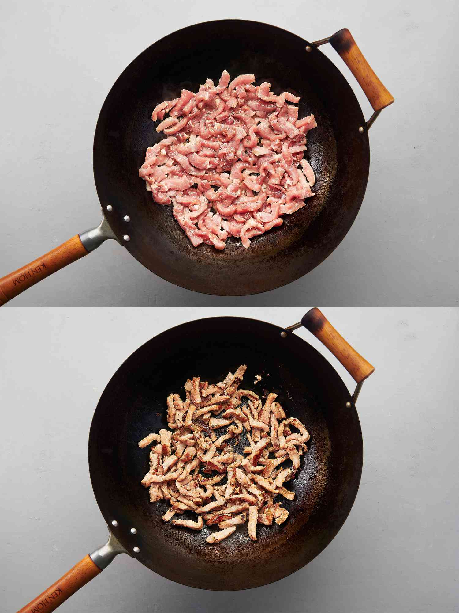 Pork spread out in a single layer over oil inside wok and pork cooked through inside wok