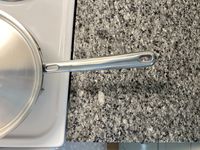 A closeup of the handle on the Misen 2-Quart Saucier.