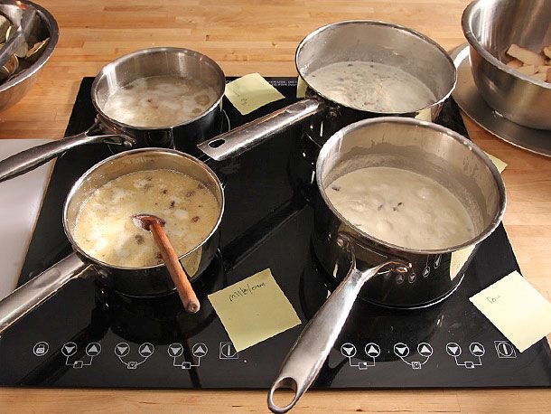 Four test batches of clam chowder using different thickening methods.