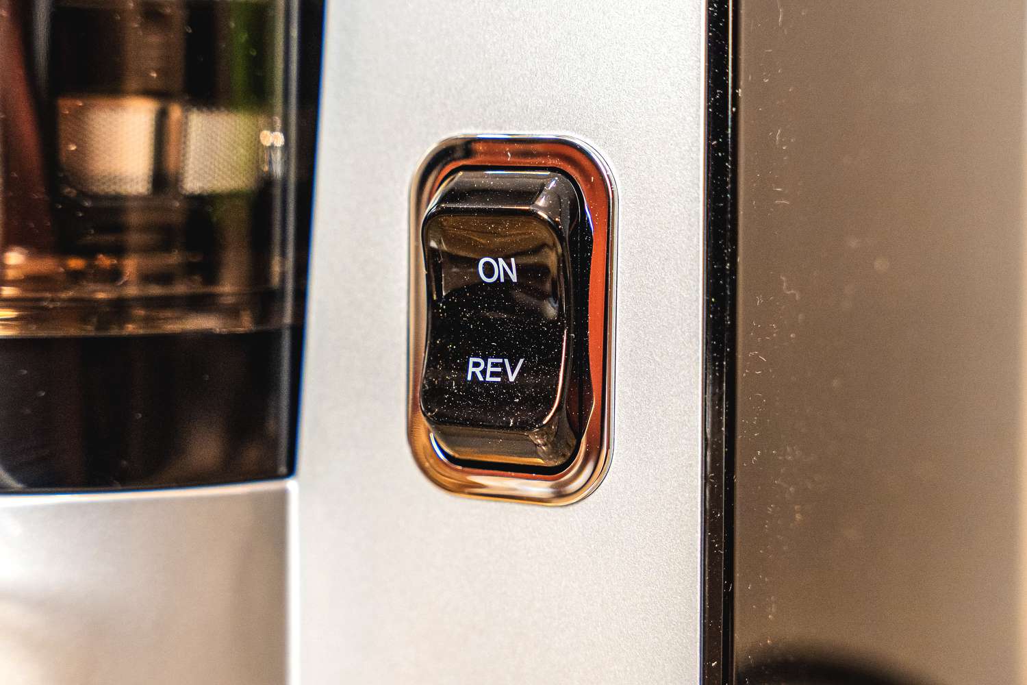 The on/reverse button of the Omega juicer