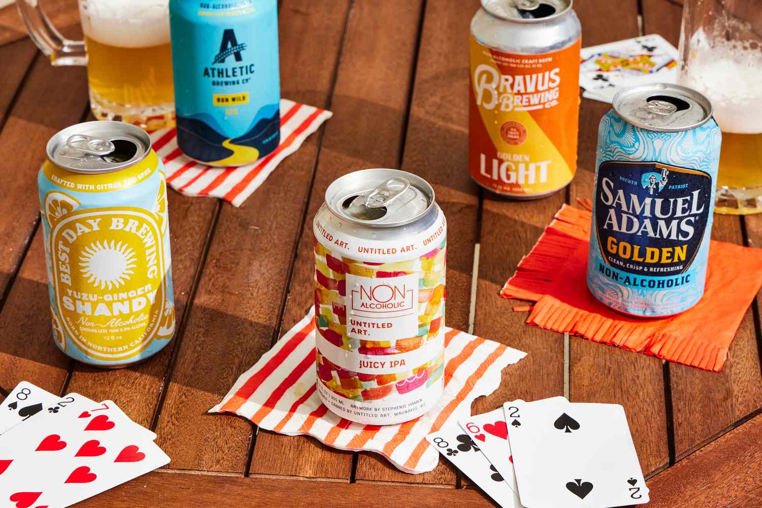 Numerous non-alcoholic beers on a wooden table.