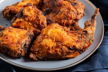 Buttermilk fried rabbit pieces on a serving plate