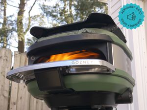 the gozney tread with a fire lit inside it