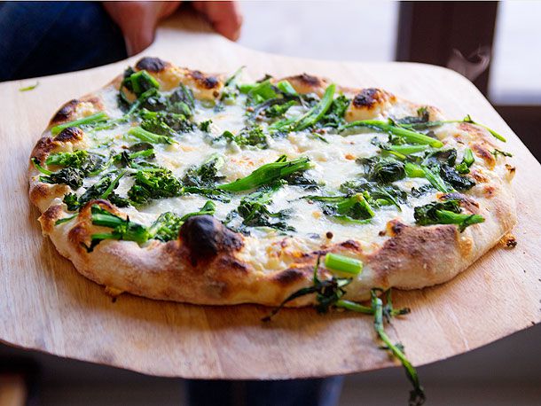 A homemade broccoli rabe pizza on a crust made with no-knead pizza dough. 