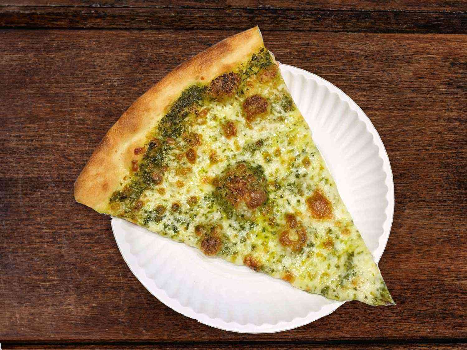 A pesto cheese slice from Dani's House of Pizza