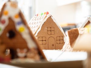 Decorative gingerbread houses arranged on a table