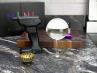 flavour blaster mini with a bubble on a coupe glass drink