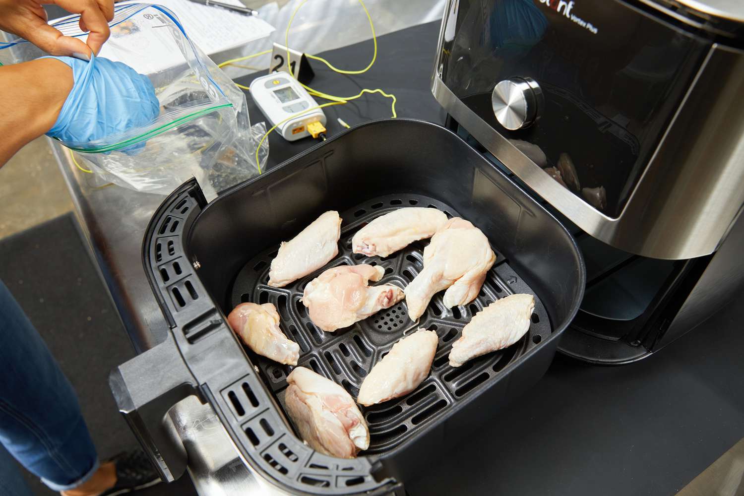 Raw chicken wings in the Instant Pot Vortex Plus 6-Quart 6-in-1 Air Fryer's basket