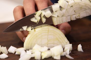 Side view of dicing an onion