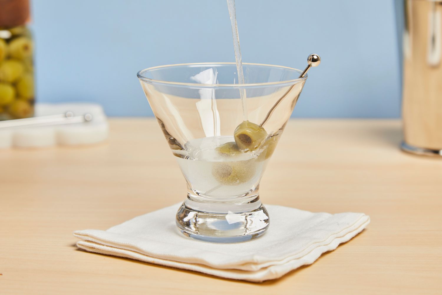 Liquid being poured into Libbey Cosmopolitan Stemless Glass