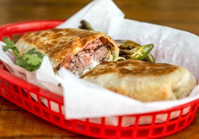 cross section view of a plancha-seared Dorado-style burrito 