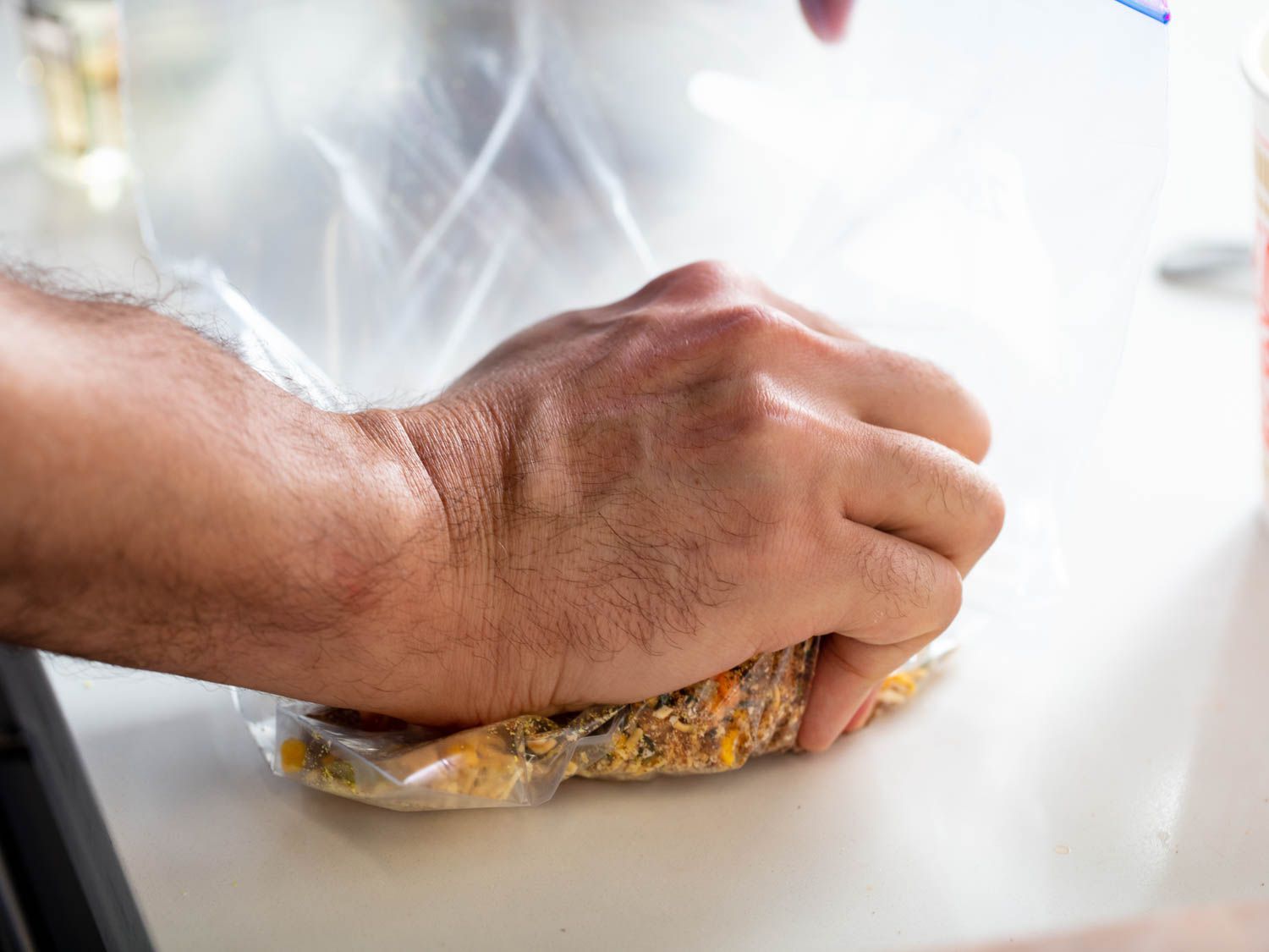 Cup noodles are crushed in a plastic bag.