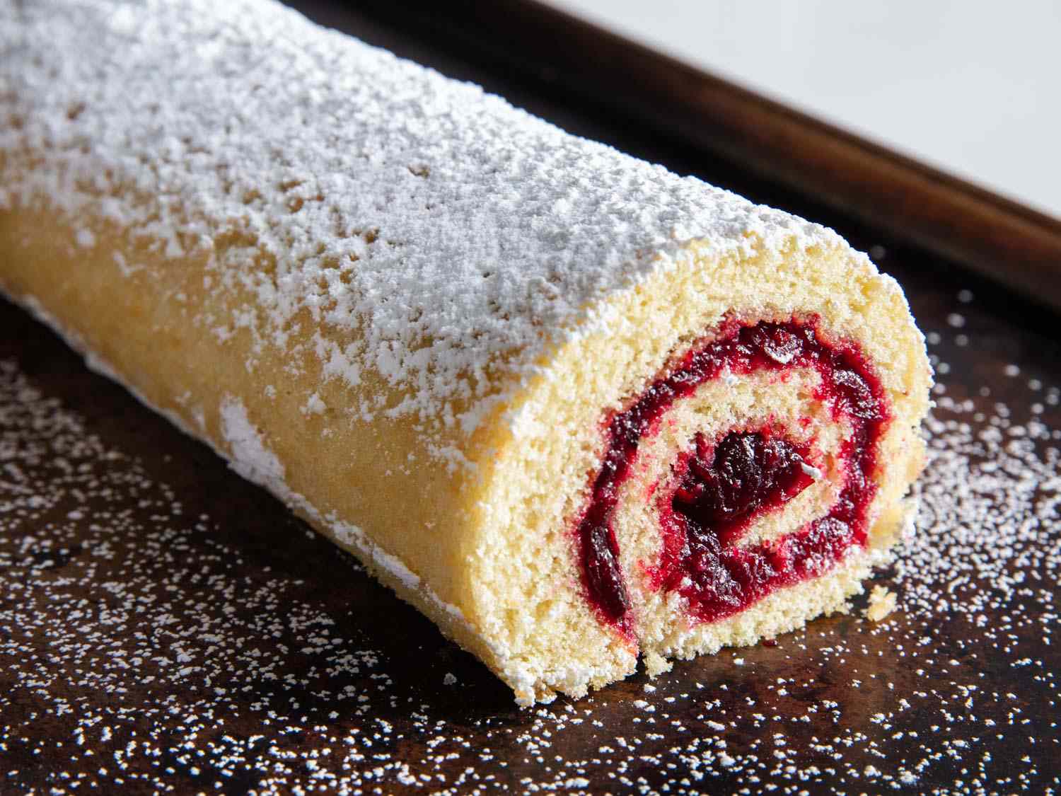 A classic jelly roll cake dusted with powdered sugar