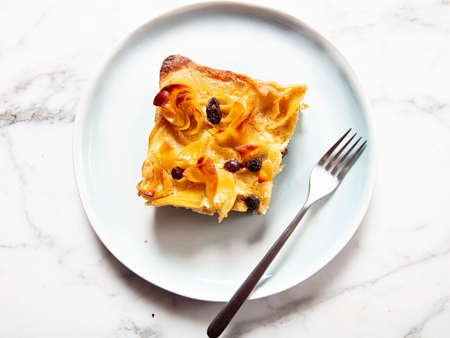 Overhead view of a slice of noodle kugel