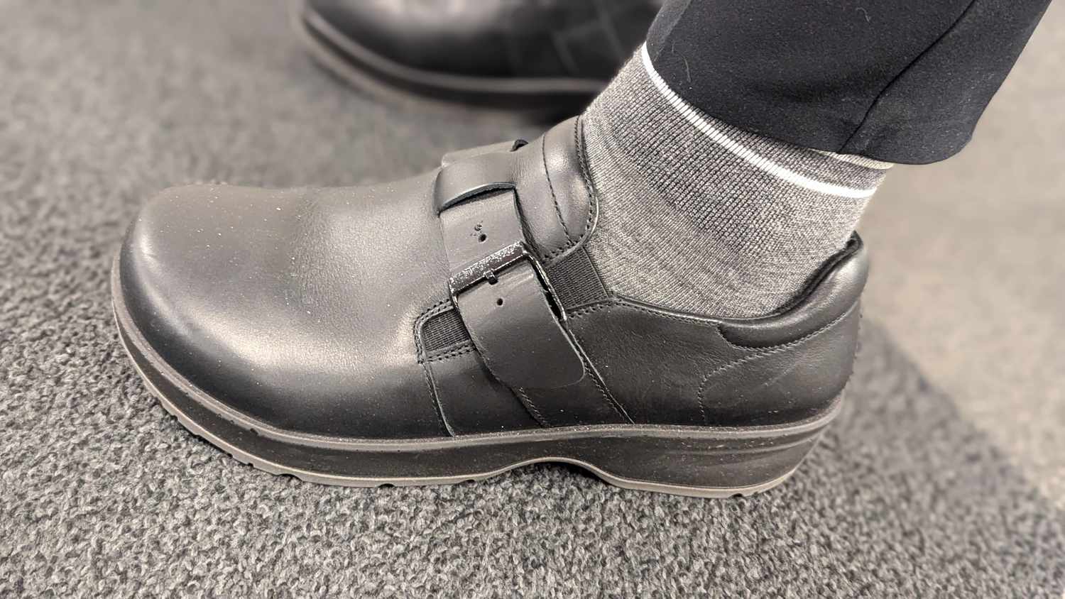 A person wearing the Birkenstock Caris shoes.