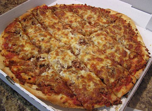A sliced sausage pizza from John's in Munster, Indiana.