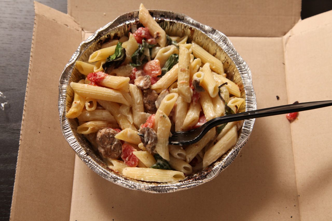 Pasta primavera from Domino's in an aluminum take out container 