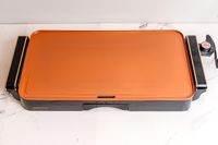 The Crux electric griddle on a white marble countertop