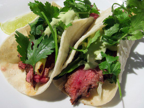 Closeup of a pair of chipotle steak tacos.