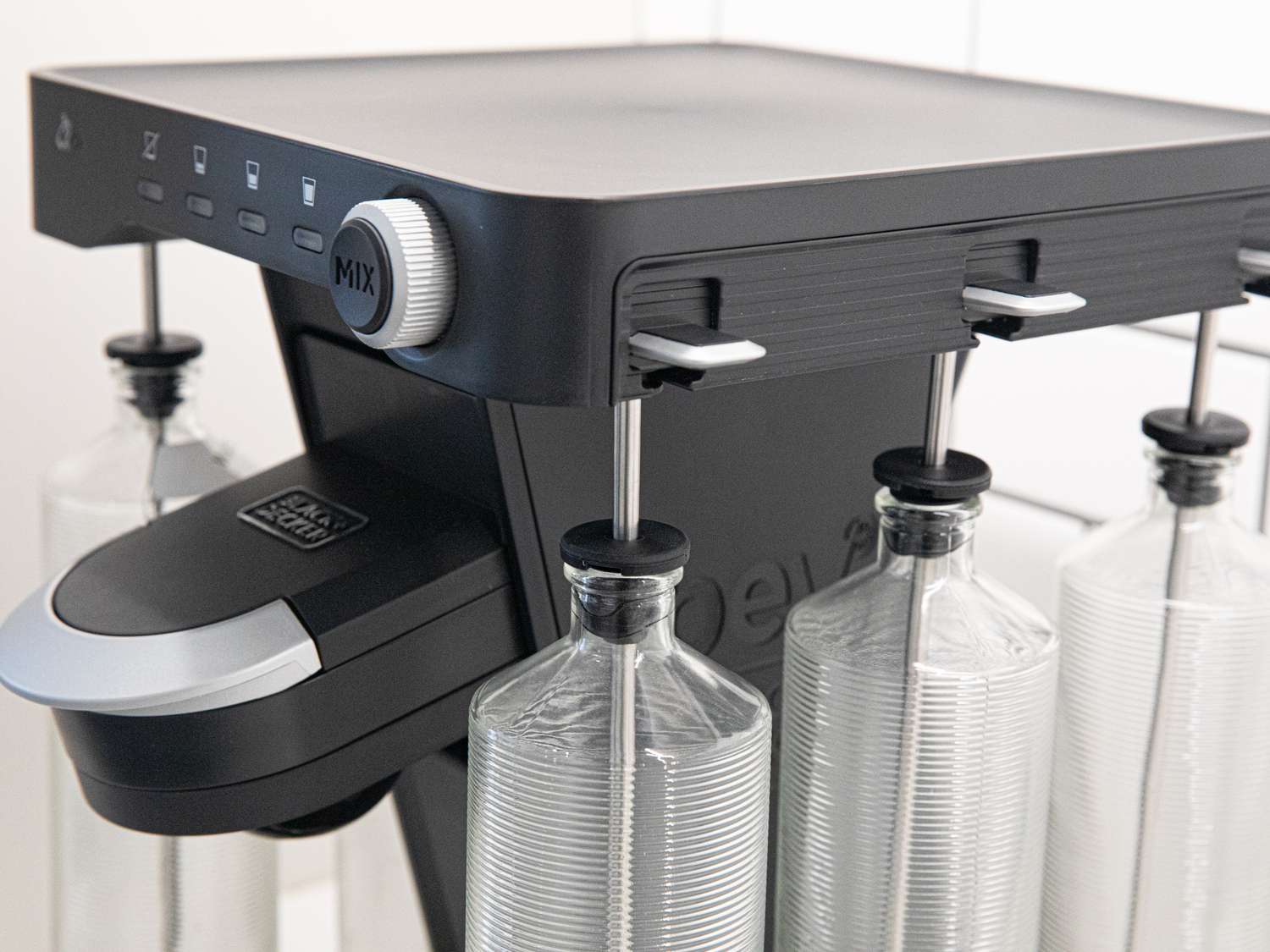 A side-angle look at the Bev with its ribbed glass bottles attached