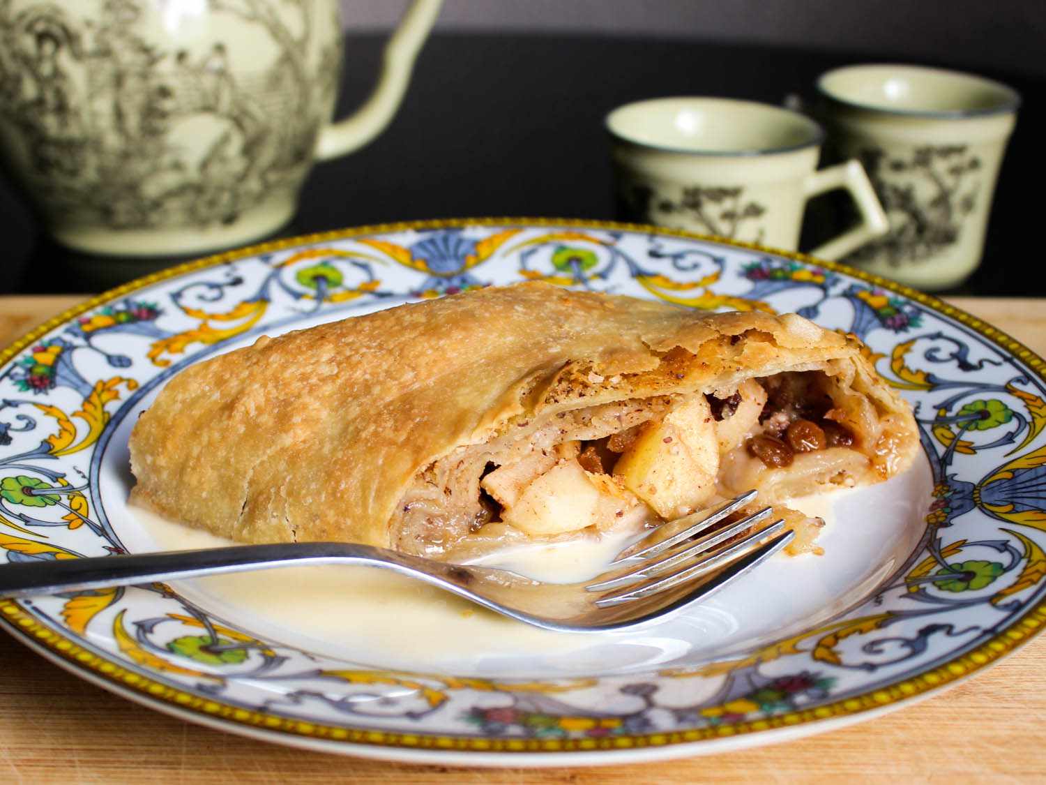 Apple strudel on a plate with a fork. 