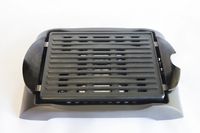 The Zojirushi indoor grill on a white surface